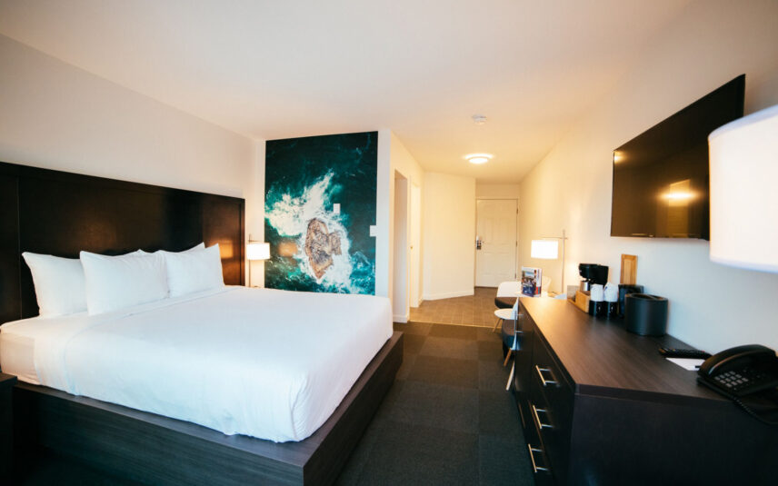 Deluxe room in Tofino with west coast-inspired art and cozy furnishings