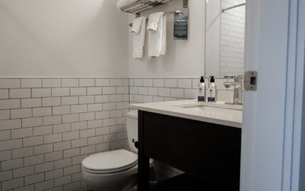 Clean modern bathroom with shower and soft lighting