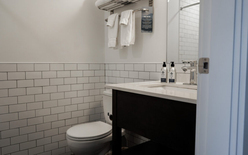 Clean modern bathroom with shower and soft lighting