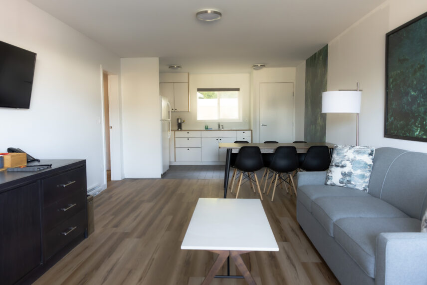 Modern and coastal Tofino hotel living room with tons of natural light and kitchenette