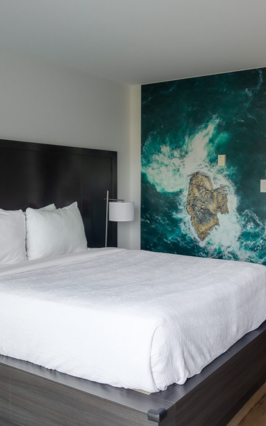 Deluxe room in Tofino with west coast-inspired art and cozy furnishings