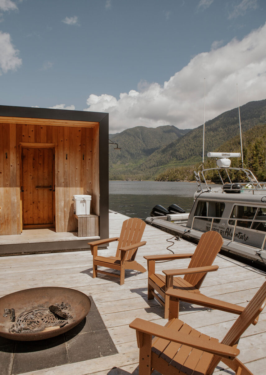 Floating sauna and private boat docked on Tofino’s calm waters, ready for adventure