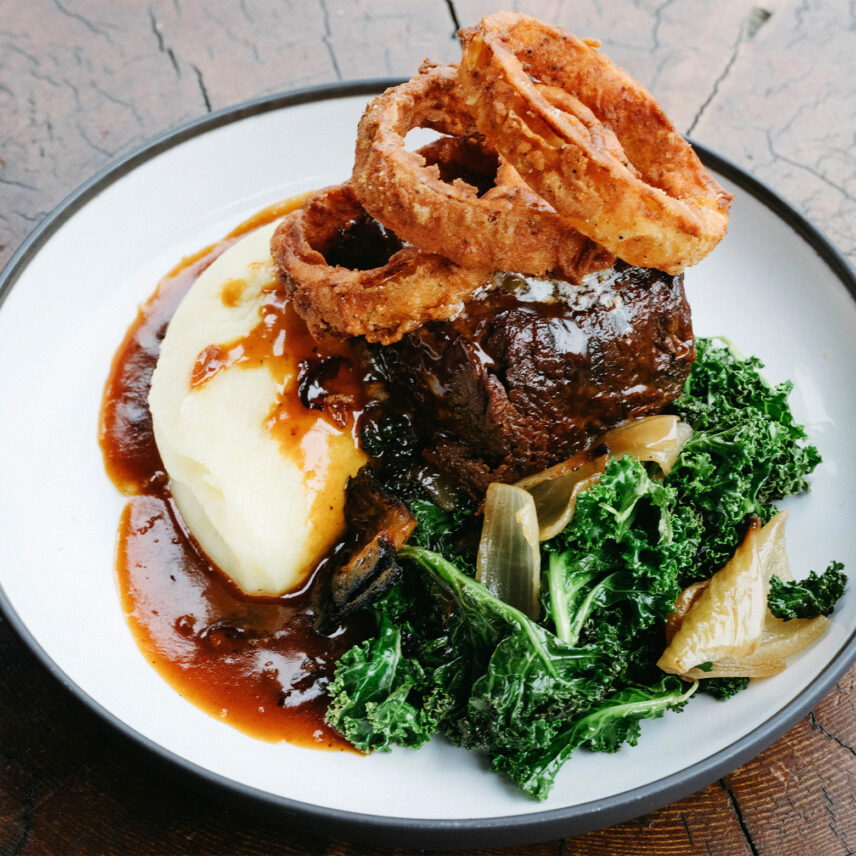 A gourmet entrée with rich textures and fresh herbs