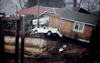 Historic photo of wrecked houses in Port Alberni after a tsunami