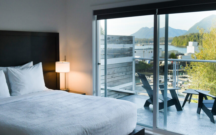 Queen suite with natural light and partial view of the harbour through wide windows