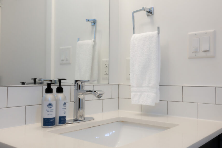 Modern bathroom with shower and sleek fixtures in queen suite