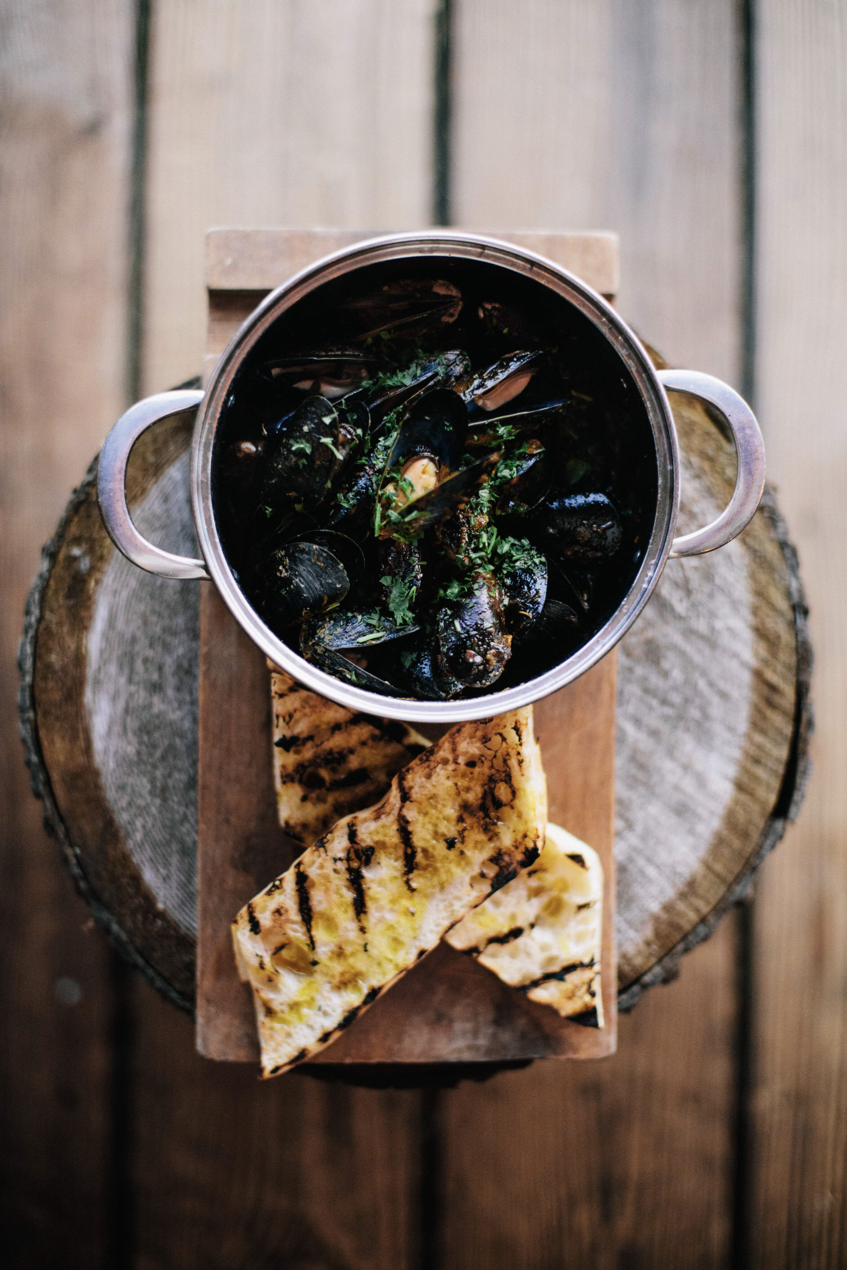 Fresh mussels with garlic bread served at Shelter Restaurant as part of a Tofino culinary getaway