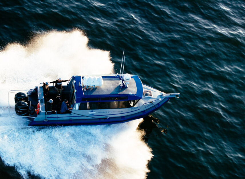 Covered Blackfish tour boat cruising through Clayoquot Sound