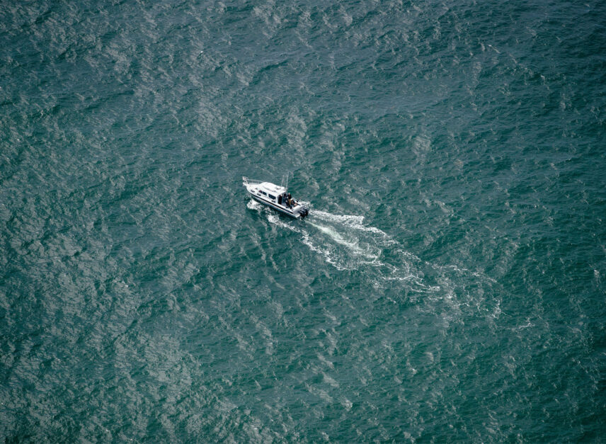 Aerial view of the Reel Season boat cruising through Clayoquot Sound