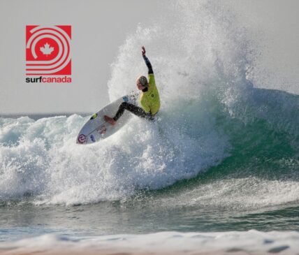 A surfer executing a smooth turn on a wave, with the Rip Curl Canada logo prominently displayed