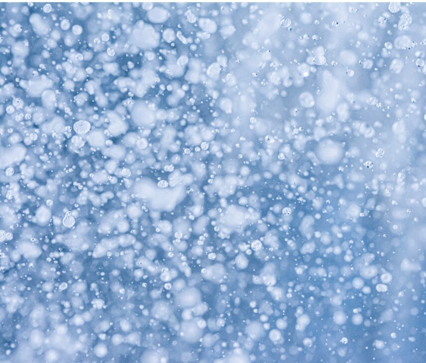 Water and snow close up abstract blue and white